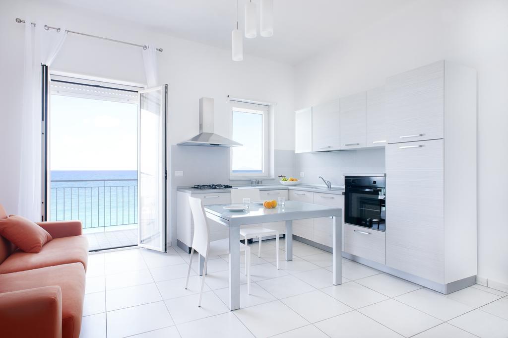 Vuelle Residence Apartments Capo dʼOrlando Szoba fotó