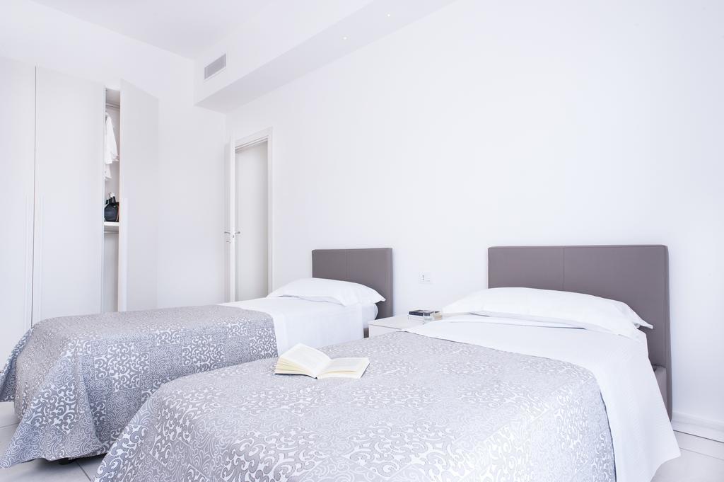 Vuelle Residence Apartments Capo dʼOrlando Szoba fotó